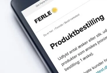 Mobiltelefon med FERLEs bestillingsside